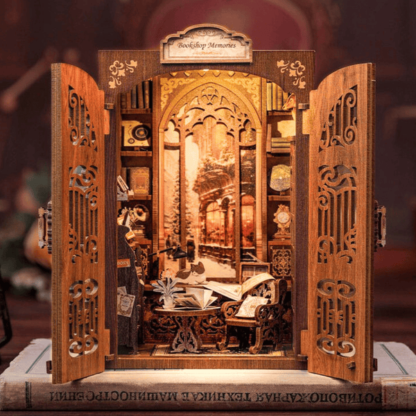 Miniature book nook kit of a vintage bookshop with detailed wooden doors and tiny books